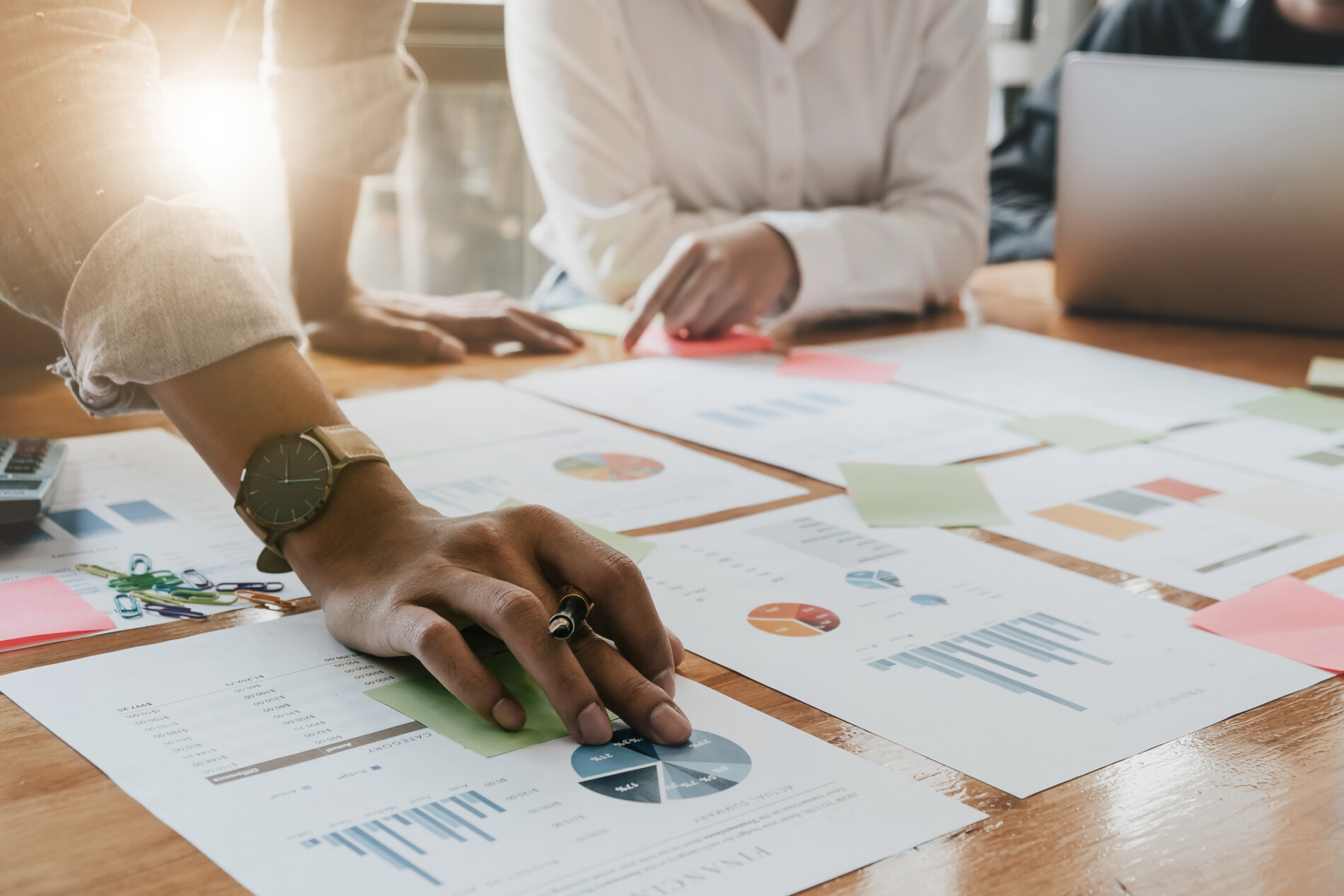 Strategy team analyzing market data and charts