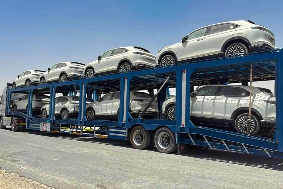Car carrier truck transporting new SUVs